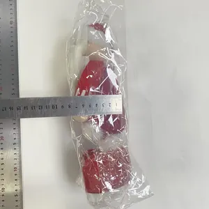 Detailed measurement showing the size of a tall Christmas plush doll in packaging