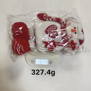 Weight measurement of a festive Christmas snowman plush toy in packaging