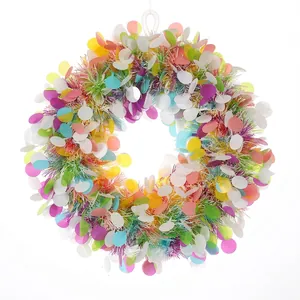 Close-up macro detail showing vibrant colors and sequins of this Christmas wreath