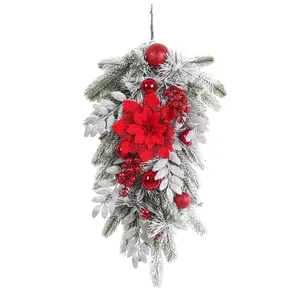 Elegant red Christmas flocked teardrop swag with poinsettia flowers and ornaments