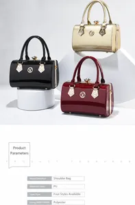 Close-up view of stylish patent leather handbags with metallic logo and elegant top handles.