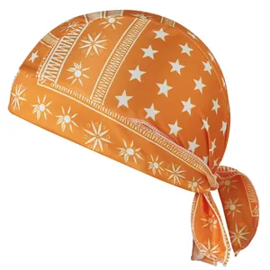 Detailed macro view of orange elastic pirate cap with white star and sunburst motifs