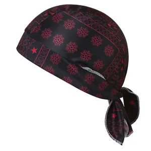 Detailed side view of black and red snowflake paisley bandana cap with tie-back