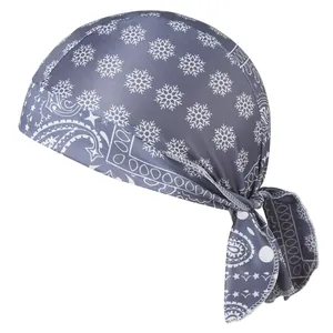 Detailed close-up of a grey pirate headscarf with snowflake and paisley print patterns