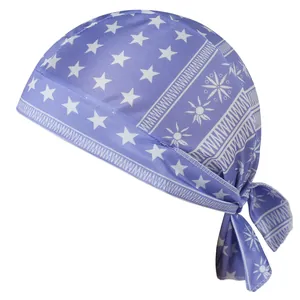 Close-up detail of blue elastic pirate hat featuring white star and sun pattern prints