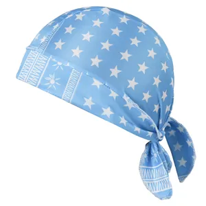 Close-up of light blue elastic pirate cap with white star and paisley patterns