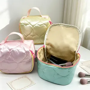 Heart quilted satin cosmetic bag trio in pastel colors for travel and makeup storage