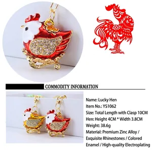 Detailed view and specifications for a cute rhinestone hen keychain in vibrant red and gold metal
