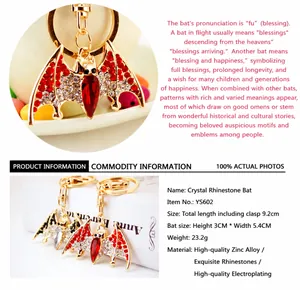 Close-up view of red rhinestone bat keychain and detailed product parameter information table