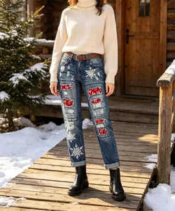 Women's festive Christmas distressed straight jeans with snowflake patches in snow