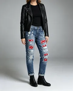 Women's distressed denim jeans featuring festive red HO HO HO patches for Christmas