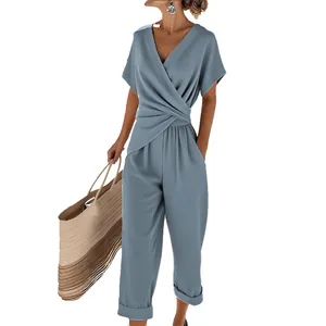 Elegant sky blue short sleeve V-neck wrap jumpsuit with wide leg trousers for summer.