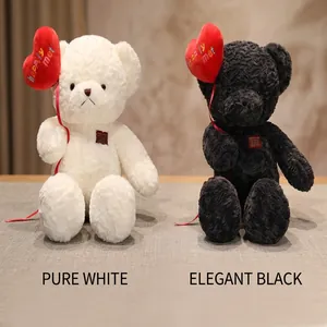 Plush teddy bears in white and black with heart balloons for Valentine's Day gift