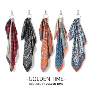 Close-up detail of five retro paisley silk square scarves hanging on silver metal rings