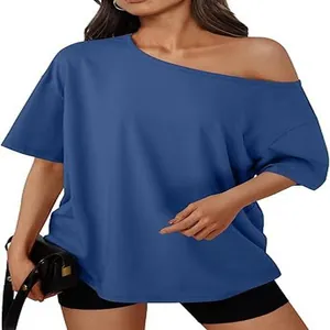 Royal blue loose off-shoulder T-shirt showing detailed fabric and trendy Y2K fit
