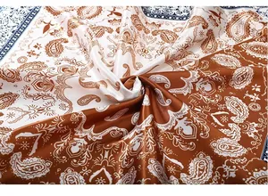 Detailed close-up showing the vintage paisley pattern on a silky satin large square scarf