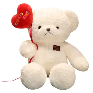 Cute white plush teddy bear holding a red heart balloon for Valentine's Day gift