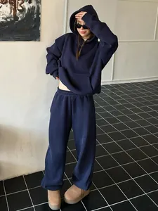 Detailed view of women's navy blue oversized hoodie and matching wide-leg sweatpants set
