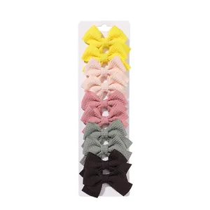 Set of 10 colorful waffle texture fabric bow hair clips for girls on display card