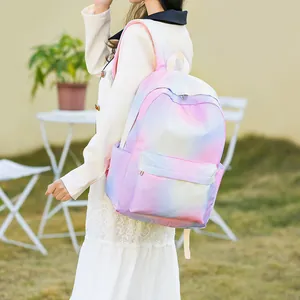 Detailed side view of a girl wearing a colorful gradient pastel waterproof school backpack