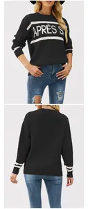 Vista dettagliata di un maglione nero con jacquard APRÈS S e polsini a righe eleganti.