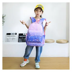 Girl wearing a purple and pink starry sky gradient waterproof school backpack in a studio