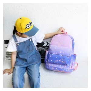 Lifestyle detail showing the side and front pocket of the purple gradient backpack