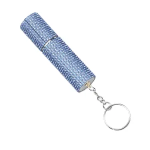 Detailed view of the sparkling light blue rhinestone refillable perfume bottle keychain.