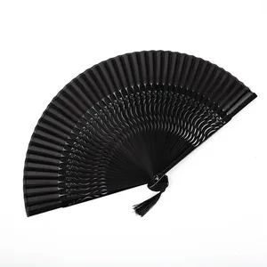 Elegante abanico plegable lacado negro con borla, estilo chino tradicional para baile