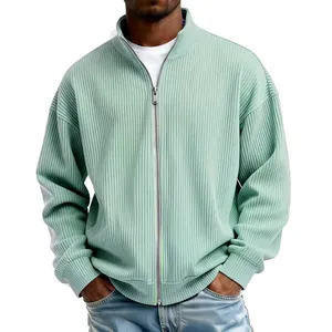 Close-up of mint green men's ribbed sweatshirt featuring full zipper and high collar detail
