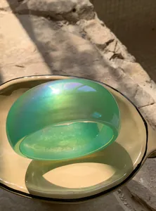 Iridescent green chunky resin bangle showing holographic shimmer in Y2K summer style.