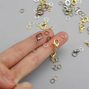 Detail view of various metallic lobster clasps and jump rings for DIY jewelry making