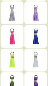 Collection of 2cm mini rayon tassels with gold rings in various vibrant colors for DIY jewelry