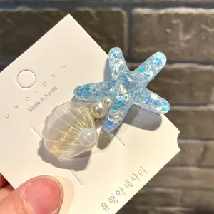 Detailansicht der Haarspange mit Seestern und Muschel im Meerjungfrau-Stil für Mädchen