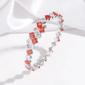 Elegant titanium steel bracelet featuring red and white square-cut zircons, open spring design.