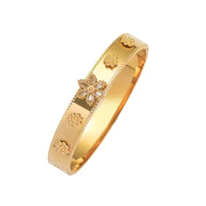 Elegant gold-plated titanium steel bangle with zircon flower motifs and spring opening