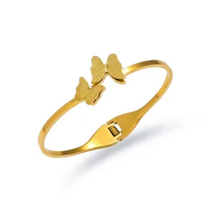Elegant gold titanium steel butterfly bangle with frosted finish and spring hinge