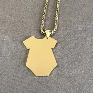 Macro view of polished gold titanium steel hip-hop necklace with unique baby bodysuit pendant