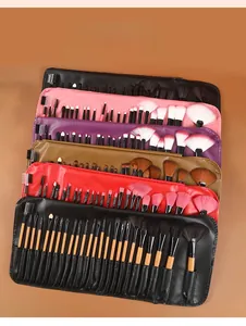 Detailed view of 24pcs professional makeup brush set in multiple colors like pink and black