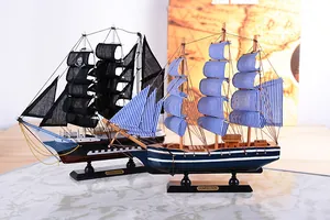 Detailed view of Mediterranean and pirate style handcrafted wooden sailing boat models