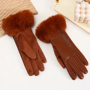 Detail of women's winter gloves with faux fur cuffs and PU leather splicing in brown.
