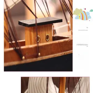 Dettaglio di un modello di barca a vela in legno mediterraneo vintage con occhielli.
