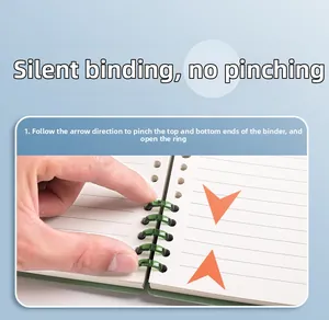 Close-up showing how to open the green translucent loose-leaf binder rings easily.