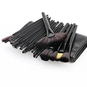 Professional 24-piece black makeup brush set with synthetic hair and leather pouch