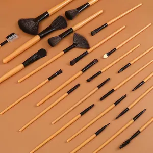 Complete 24-piece professional makeup brush set with natural wood handles and black bristles