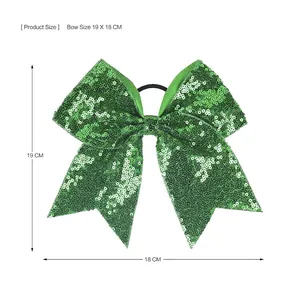 Leuchtend grüne Schleife mit Pailletten und elastischem Haarband für Kinderfeste