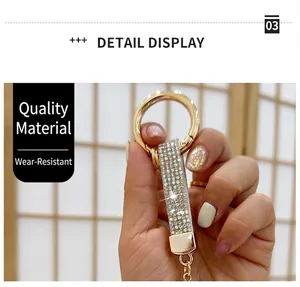 Close-up detail of rhinestone encrusted zinc alloy car keychain in gold finish