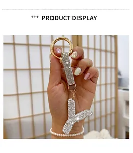 Detailed close-up view of a luxury sparkling crystal-encrusted letter Y keychain charm