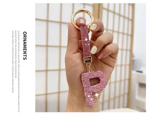 Sparkling pink rhinestone-encrusted letter P keychain with gold-tone hardware