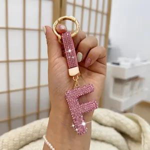 Sparkling pink rhinestone letter F initial keychain and bag charm for car keys.